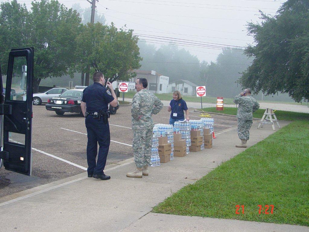 Military and police personnel set up shelter and supplies for people stuck in Hurricane Ike.